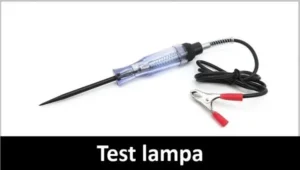 Test ili prob lampa za ispitivanje električne instalacije vozila. U donjem delu slike na crnoj traci krupnim belim slovima piše Test lampa.